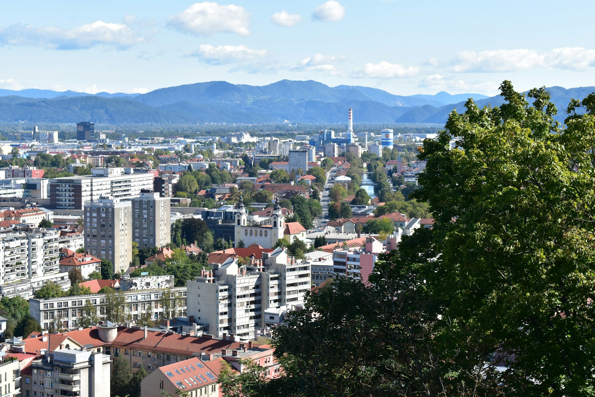 a view of a city with mountains in the background